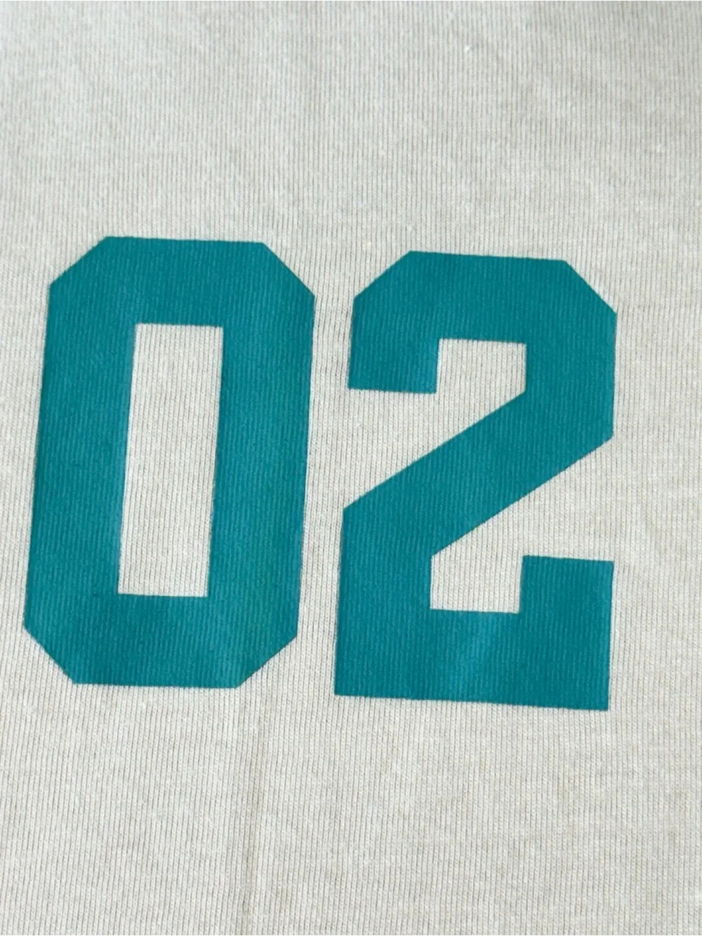 True Religion Cream Short-Sleeve Tee with Teal '02' and Orange Patch